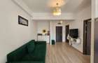 Apartament de vanzare in Summerland vedere laterala catre ac si mare - 3