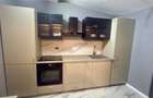APARTAMENT 3 CAMERE | 77 MP UTILI | PARCARE GARAJ | CURTE PROPRIE AMENAJATĂ + 33