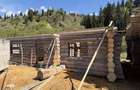 Casa din lemn rotund 100mp in faza de constructie cu relocare inclusa in pret - 2