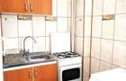 Inchiriez garsoniera decomandata , zona Titulescu , bloc anvelopat , etaj 10 din 11 , cu vedere superba catre Casa Poporului , utilata complet - 1