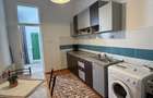 Apartament elegant cu 2 camere, loc de parcare ?i curte comuna Mara?ti