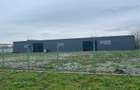 Teren intravilan de vanzare 2200m2cu hala metalica inchisa de 450m2