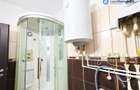Apartament 3 camere, P-ța Romană, demisol, centrală proprie