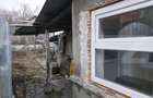 Casa cu acoperisul ars cu teren intravilan, 764 mp, zona Razvad - 10