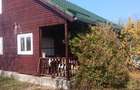 Casa de lemn + teren 2950 m2, sub 5km de centrul Tg.Mures