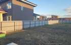 Vand teren Harman intre case cu gard