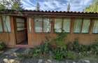 Cabana de lemn cu fundatie 86 mp+ livada pomi fructiferi+teren 847 mp