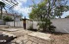 Casa de renovat cu teren 557 mp, central Str. Gh. Bari?iu - Carei