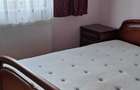 Apartament de vanzare 3 camere in Petrosani, str. Independentei, partial mobilat, doua balcoane (unul inchis), izolat termic interior - 3