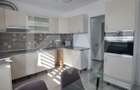 Apartament modern cu 2 camere, curte privată și 2 locuri de parcare