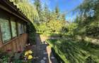 Cabana de lemn cu fundatie 86 mp+ livada pomi fructiferi+teren 847 mp