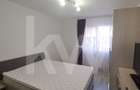 Apartament modern cu 2 camere, curte privată și 2 locuri de parcare