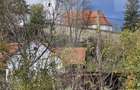Casa taraneasca in centrul localitatii Ilieni teren 832 mp. - 1