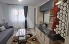 Apartament modern cu 2 camere, curte privată și 2 locuri de parcare