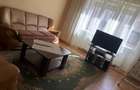 Inchiriez un apartament central. cu 2 , camere , living, curte - 7