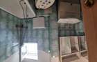 Apartament 2 camere decomandat, centrul ora?ului Brezoi, vedere la Varful ?ur?udan