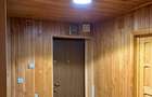 Casa de vanzare cu o suprafata construita de 205 metri patrati dispusa pe trei niveluri, demisol, parter si etaj.