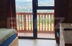 Cabana din bustean masiv si o suprafata de teren de 9000 mp in Vatra Dornei