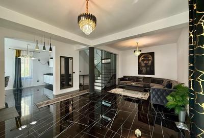 Vila de vanzare cu design deosebit in cartierul Bucium