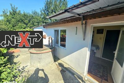 Casă cu 4 camere cu Teren 3700 Mp în Țibucani
