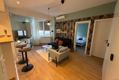 Apartament cu 2 camere semidecomandat, mobilat în P-ța Universității - 19