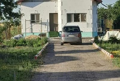 Casă cu Teren 2300 Mp în Cartojani - 1