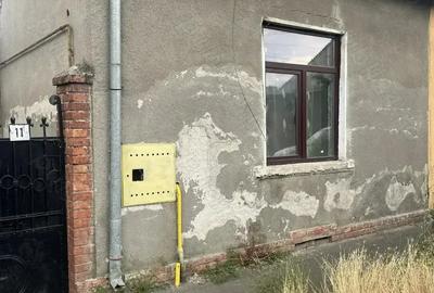 Casa la curte comuna