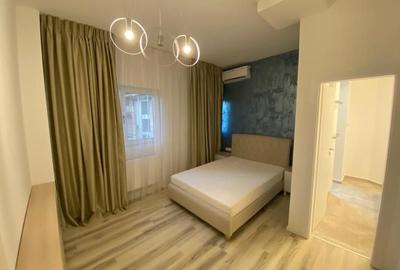 Apartament cu 5 camere semidecomandat, mobilat în P-ța Rosetti - 21