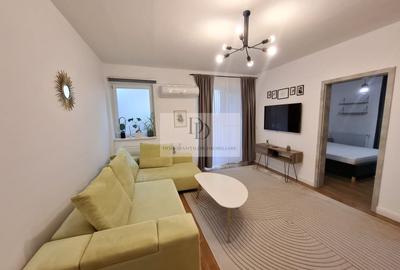 Apartament cu 2 camere semidecomandat, mobilat în Borhanci