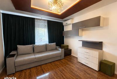 Apartament cu 2 camere semidecomandat, mobilat în Km 4